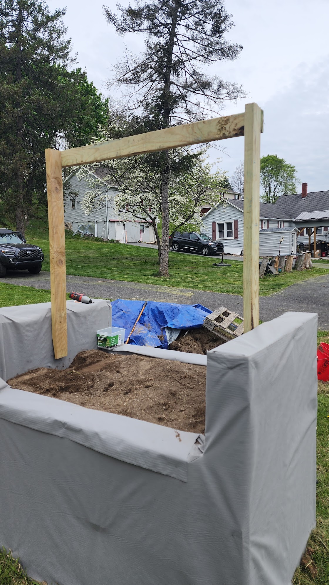 Pallet bed with three 2 by 4 sections to make trellis